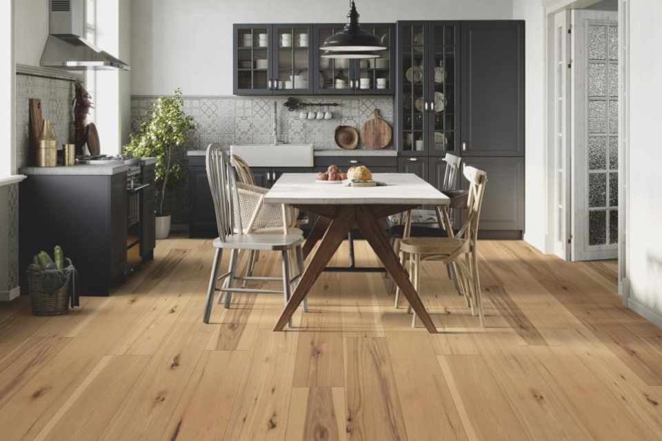 hickory hardwood in farmhouse style kitchen with mismatched wood dining chairs